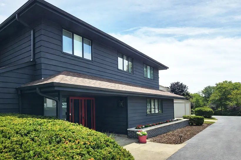 Well-maintained painted home exterior in soft daylight