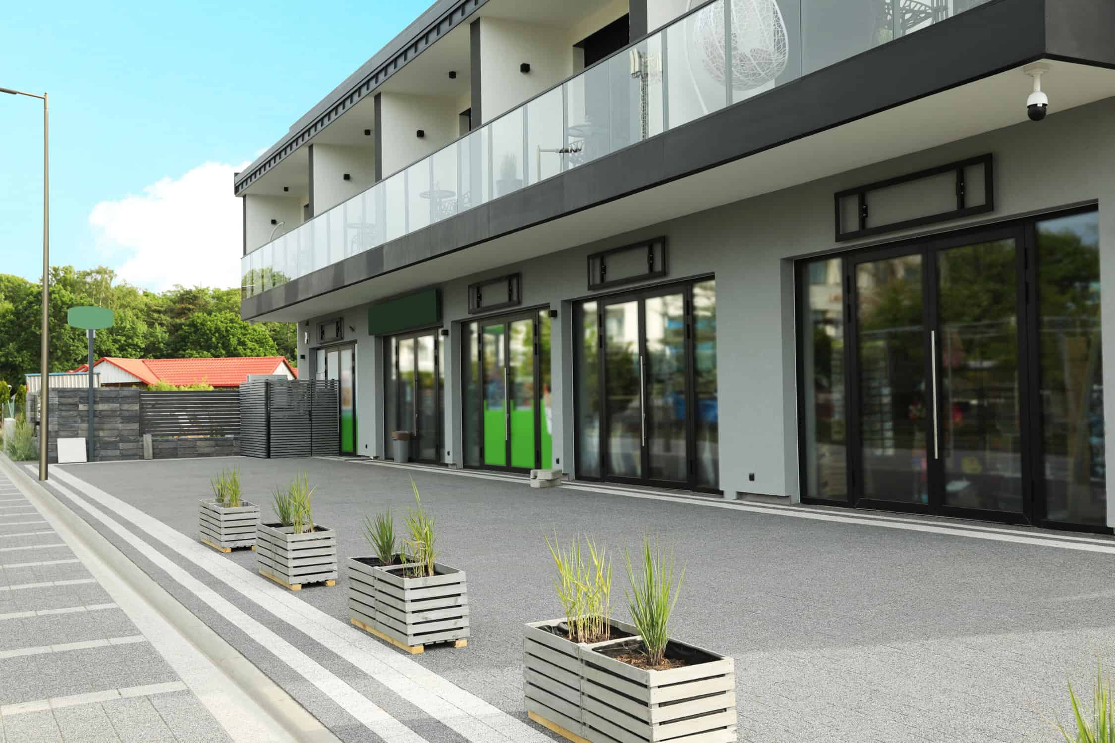 Professional painting project — Modern Storefront With Planters