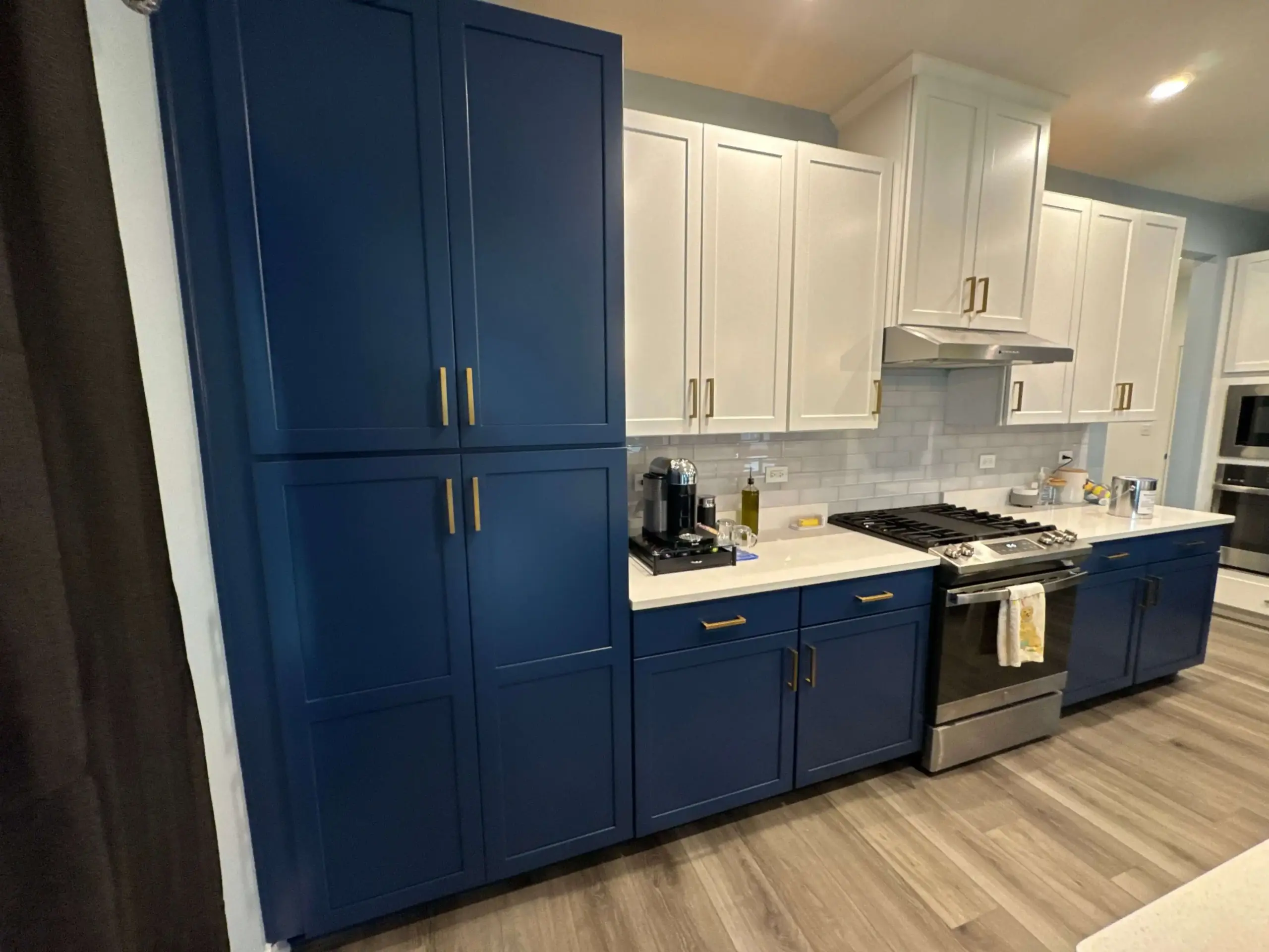 Professional painting project — Navy White Kitchen Cabinets