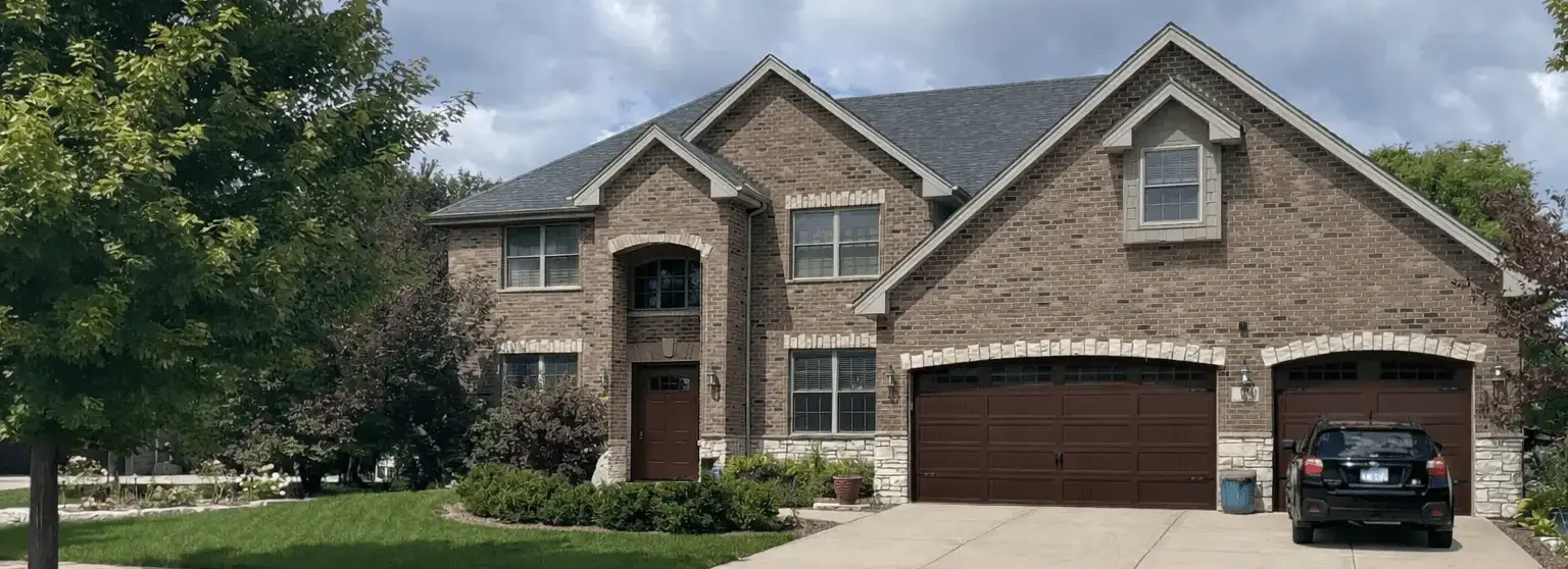 Painted brick home exterior with cohesive trim color